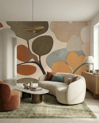 Living room glows with the Emils Bouquet wall mural in rust and sage