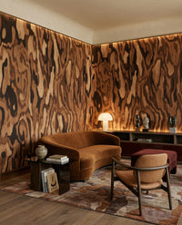 Tucked behind a calm Living room layout, the Ettore wall mural looks earthy and full.