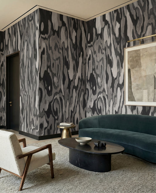 Ettore Root wall mural lends marbled monochrome rhythm to the living room.