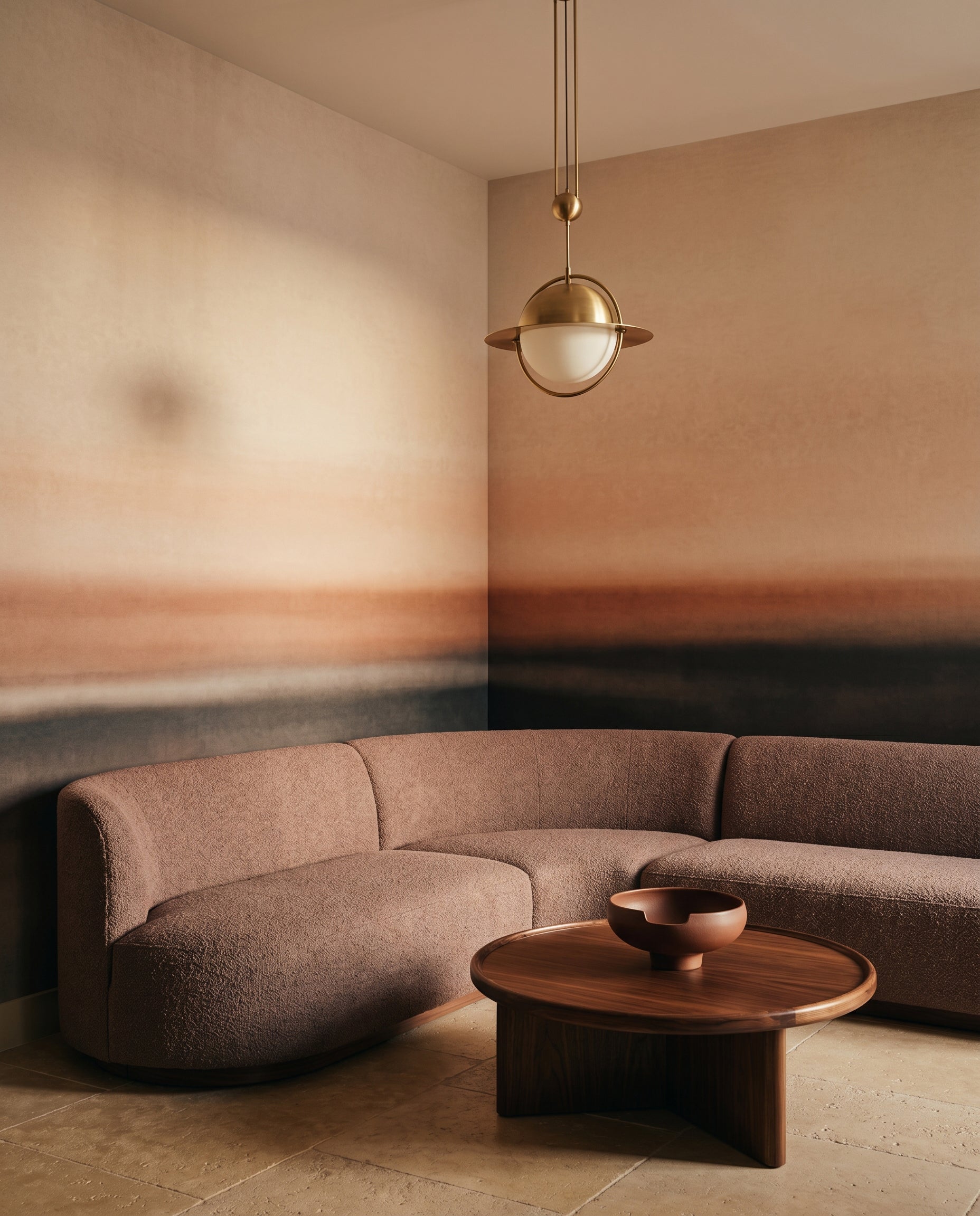 Lounge backdrop in blush and rust tones from the Rotko Dawn wall mural