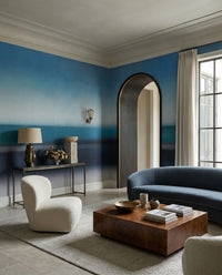 Living room styled around the Rotko Veil wall mural's blurred sea bands