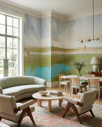 Living and dining room into the brushwork wall mural with marsh ribbons and coral posts.