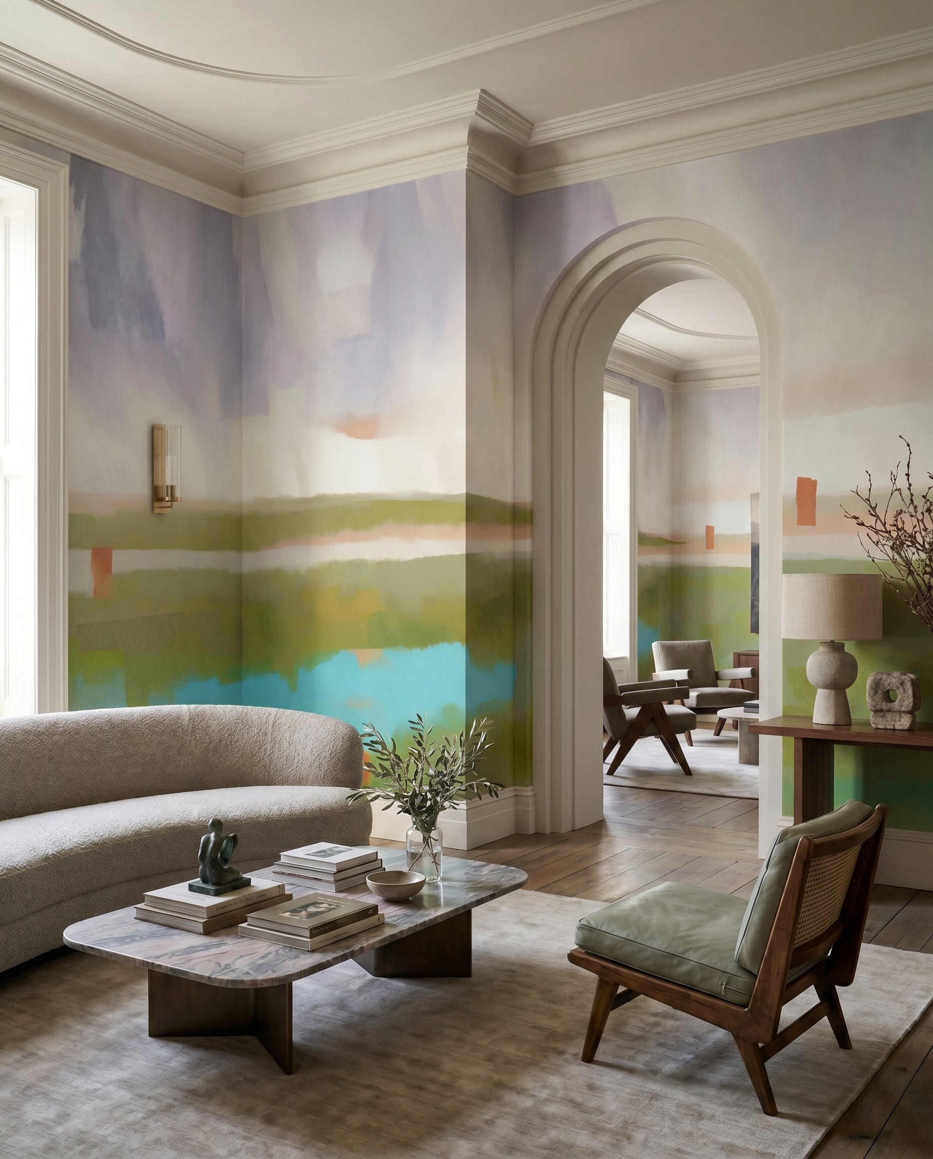 Lounge sitting beside the painterly Velvet Dawn wall mural and turquoise pool tones.