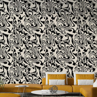 Swirling obsidian and ivory organic shape wallpaper.
