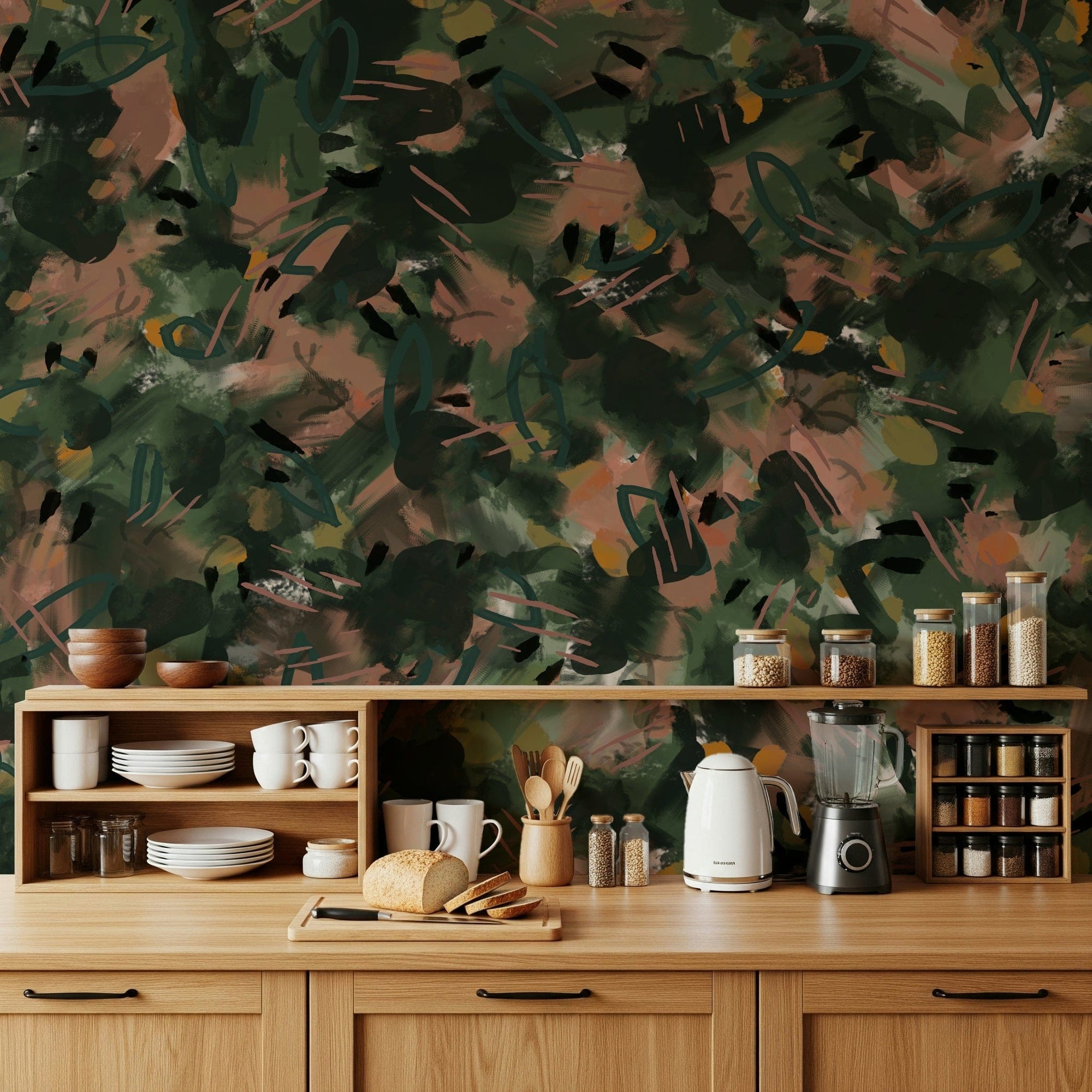Abstract Earth Tones wallpaper mural in green and terracotta brushstrokes above a wood kitchen counter and dishware