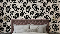 An abstract wall mural with a repeating foliage pattern.

