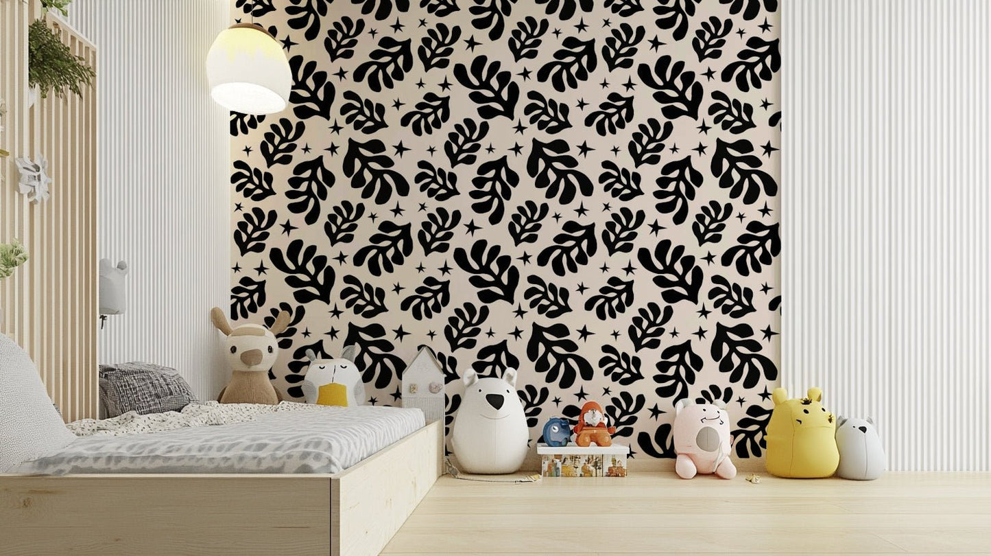 The design features artistic, stylized leaves and plants.

