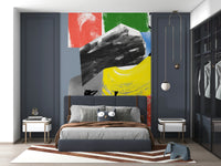 An abstract wallpaper featuring bold red, blue, green, yellow, and black brushstrokes in a dynamic modern composition.