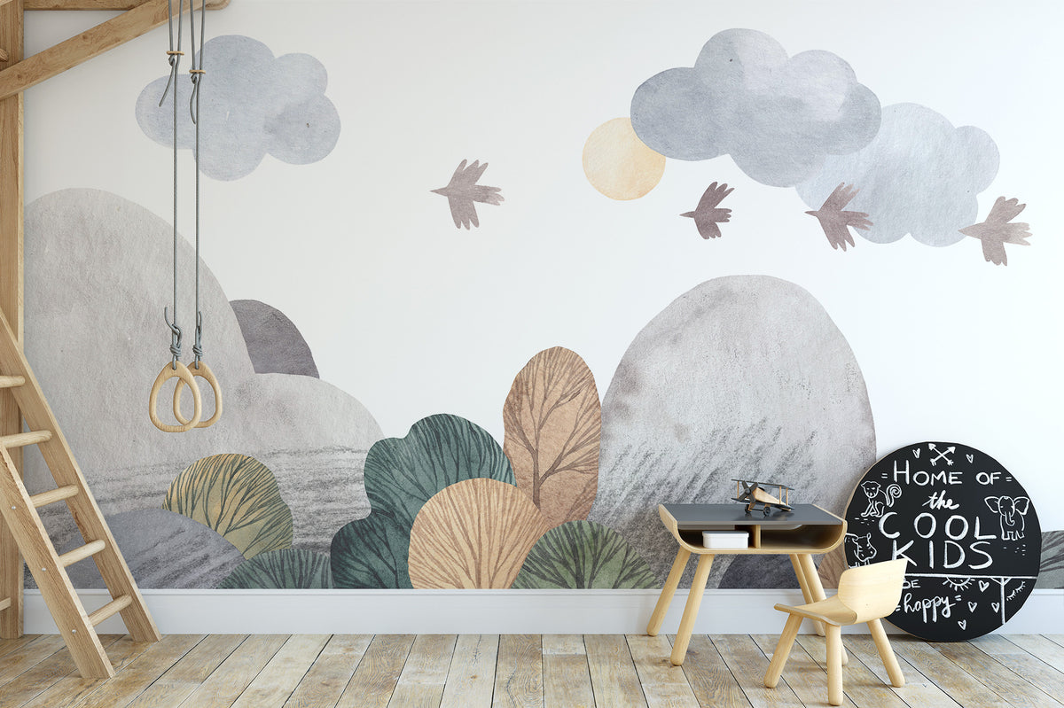 Abstract watercolor landscape wallpaper mural with hills and clouds behind a play table in a kids room with loft ladder