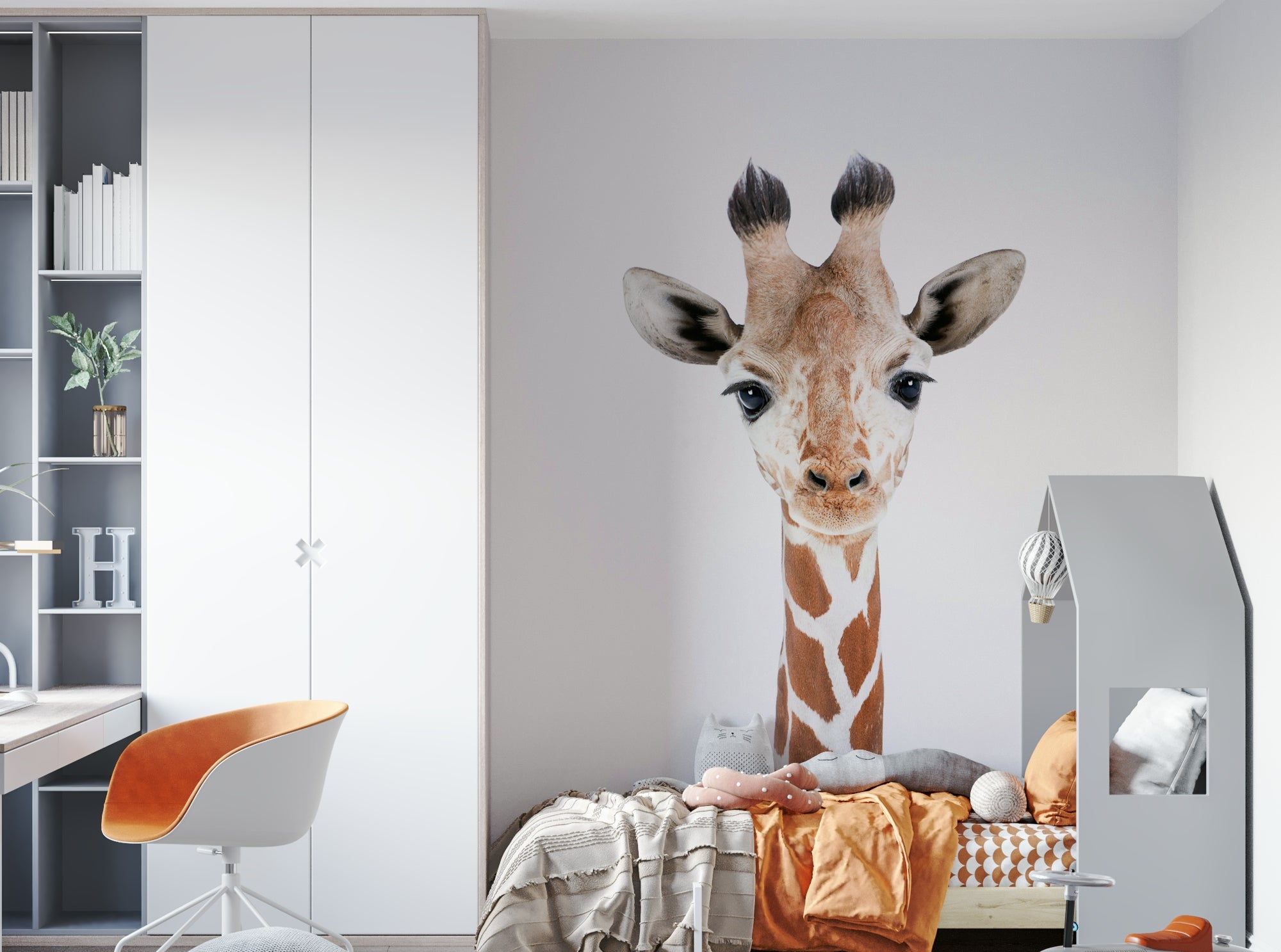 Baby Giraffe wallpaper mural on a kids room wall beside a white wardrobe, orange desk chair and bed