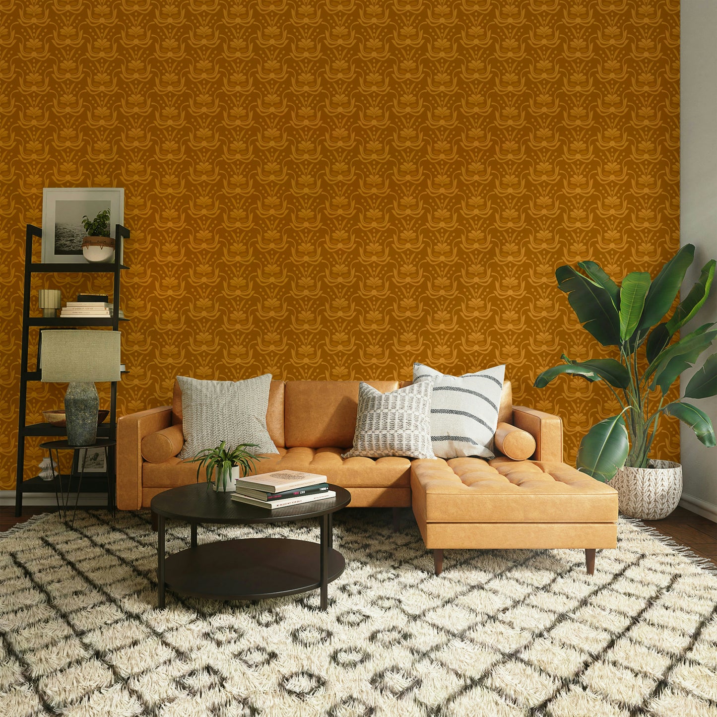Amber Hues wallpaper in golden amber behind a tan leather sectional sofa and banana plant in a living room