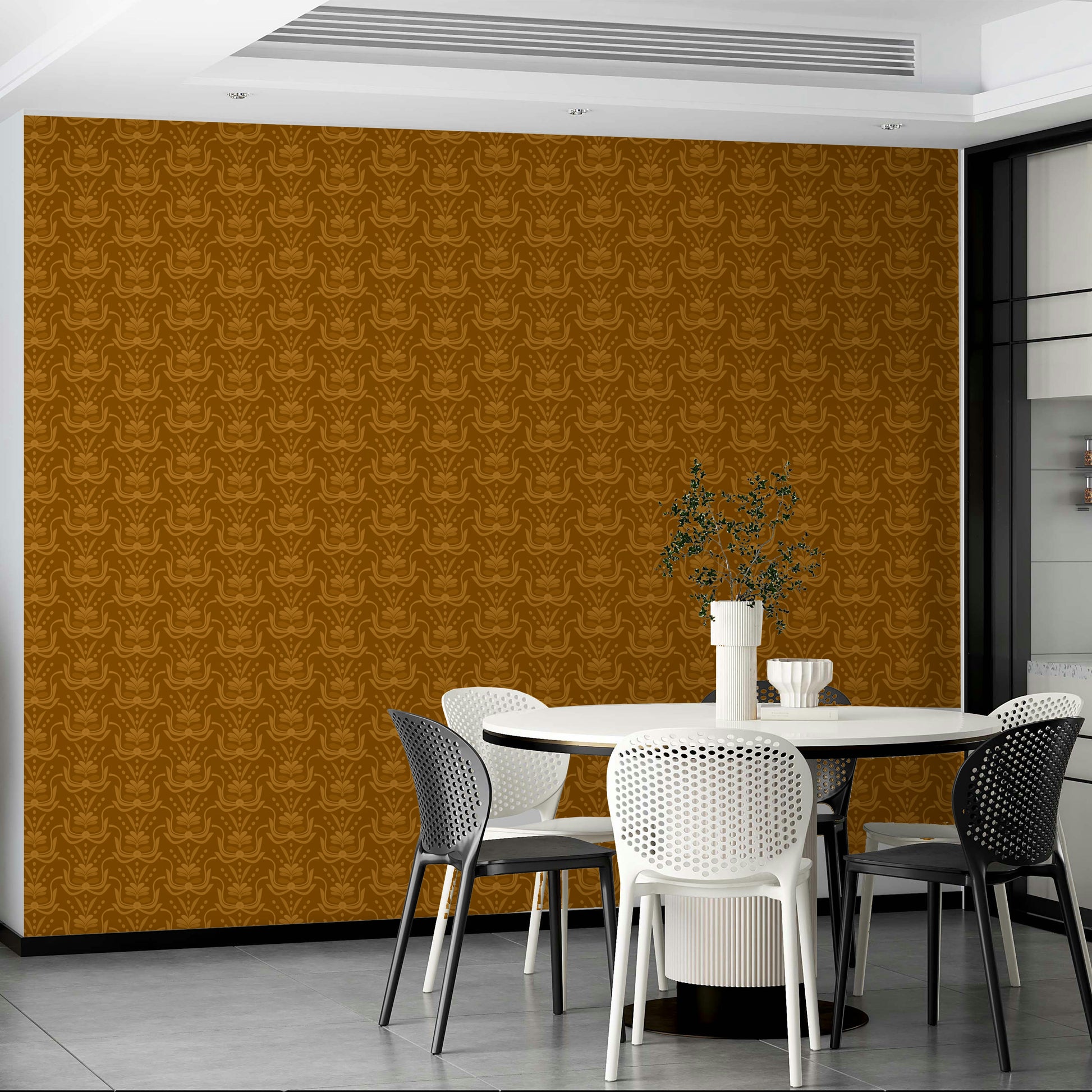 Amber Hues wallpaper in warm ochre behind a white round dining table with black and white chairs