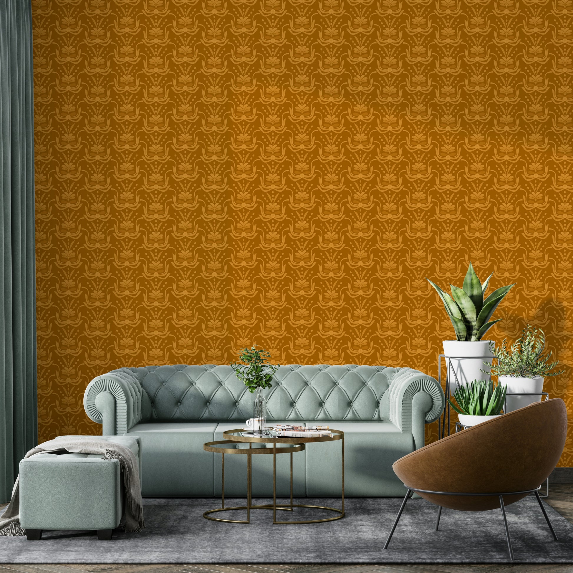 Amber Hues wallpaper in golden ochre behind a sage green tufted sofa and brown leather chair
