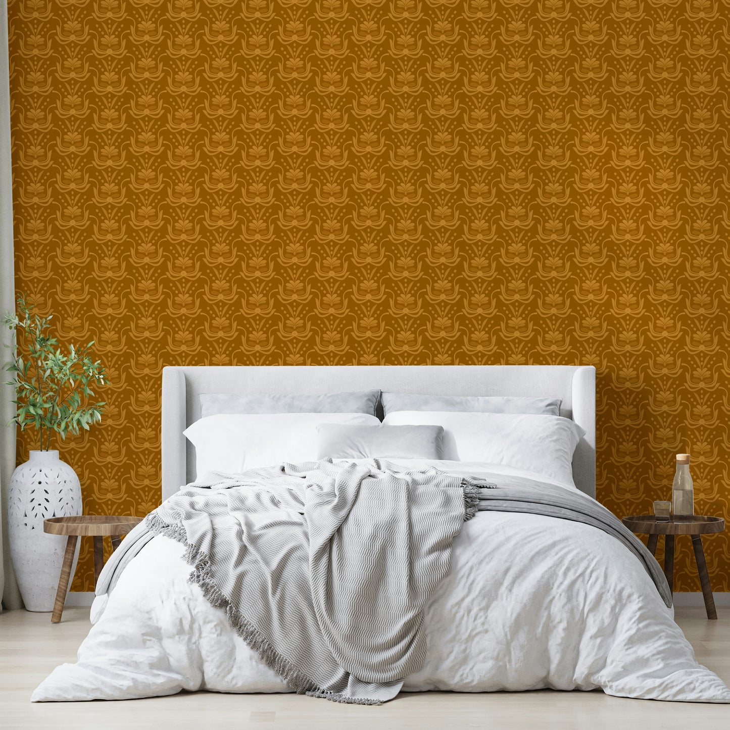 Amber Hues wallpaper in mustard damask above a white bed with a grey throw and wood side benches