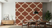 Moroccan-inspired ogee print wallpaper in warm terracotta