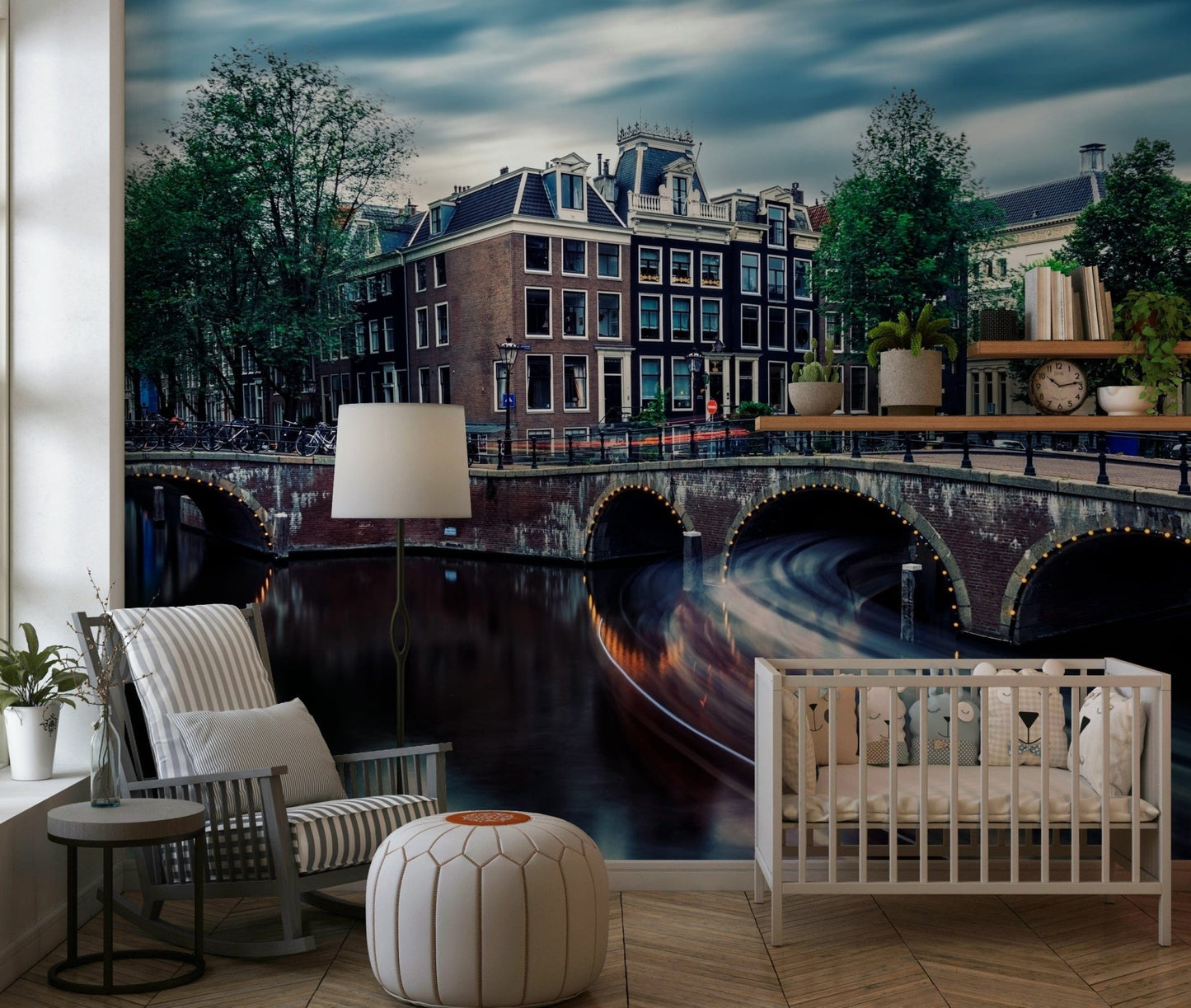 Amsterdam Canal Dreams wallpaper mural of the canal and bridges behind a white crib and rocking chair in a nursery