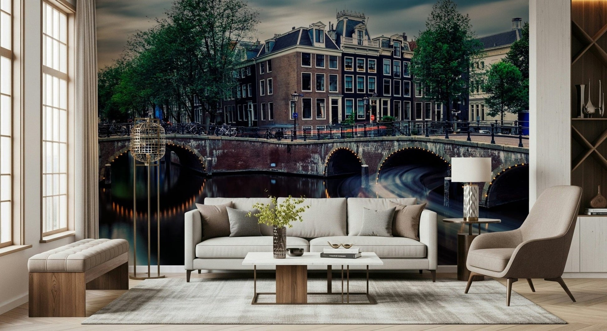 Amsterdam Canal Dreams wallpaper mural of the canal at dusk behind a cream sofa and globe floor lamp in a living room