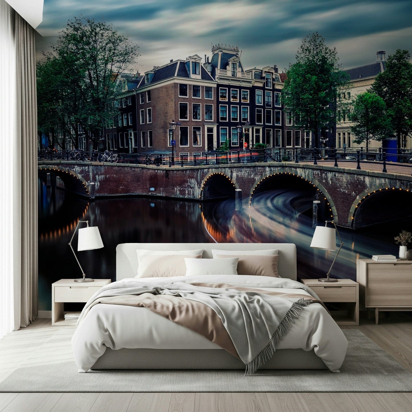 Amsterdam Canal Dreams wallpaper mural of the dusk canal and Dutch houses behind a white bed and lamps in a bedroom