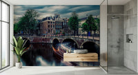 Amsterdam Canal Dreams wallpaper mural of the canal at dusk beside a wood floating vanity in a grey-tiled bathroom