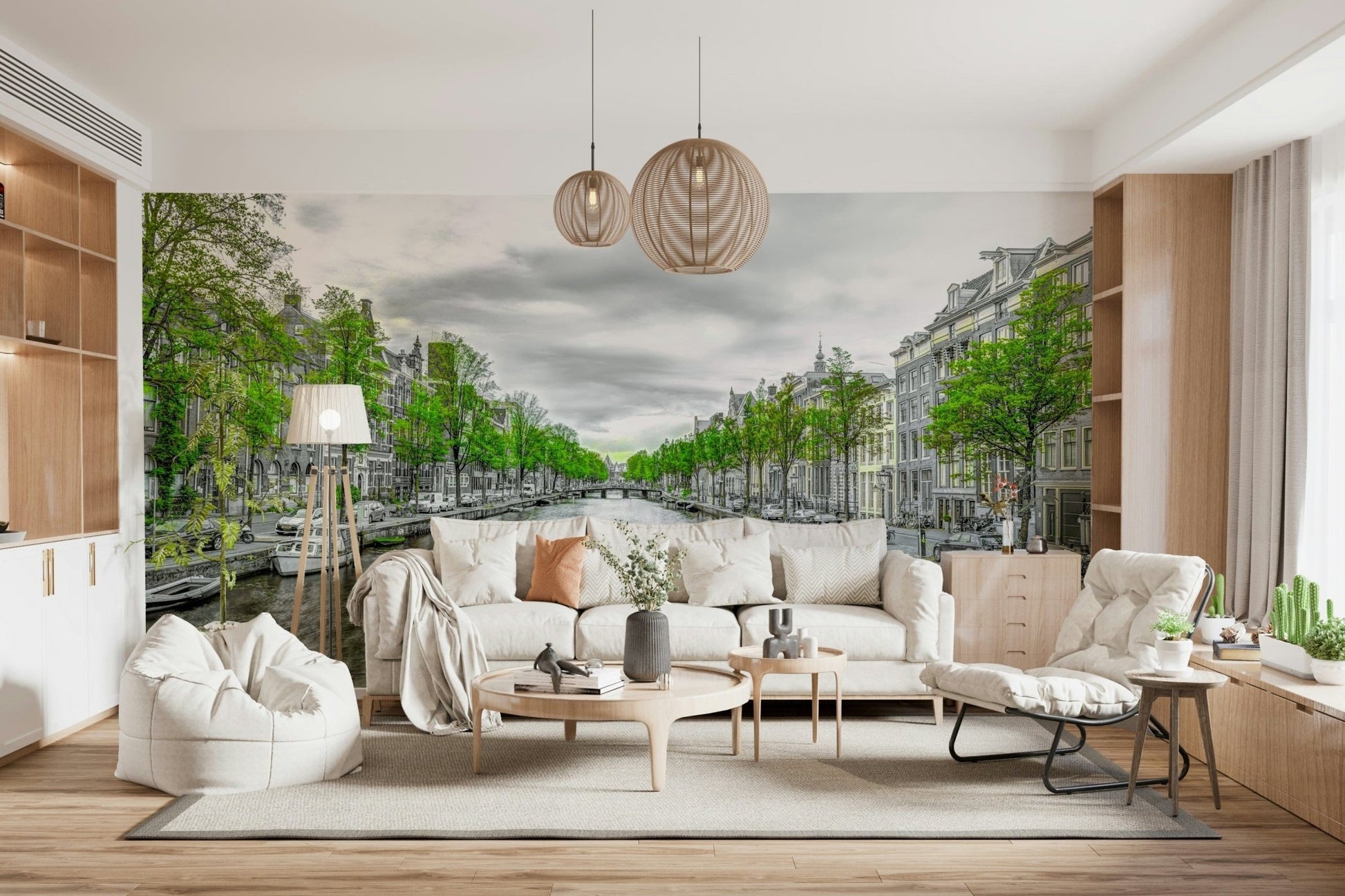 Amsterdam Canal Serenity wallpaper mural of a tree-lined canal behind a white sofa and woven pendant lights in a living room