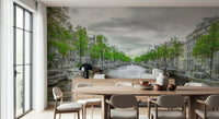 Amsterdam Canal Serenity wallpaper mural of a canal and townhouses behind an oval wood dining table and beige chairs