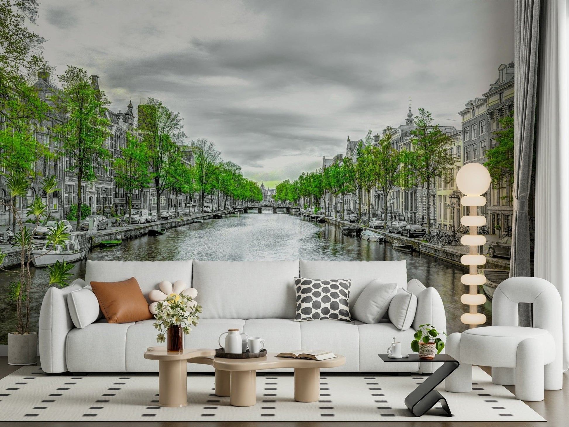 Amsterdam Canal Serenity wallpaper mural of a gray canal with green trees behind a white sofa and globe lamp in a living room