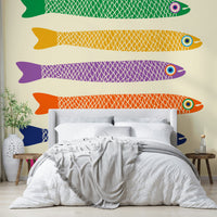 Whimsical fish mural with rainbow colors set on a soft cream canvas.


