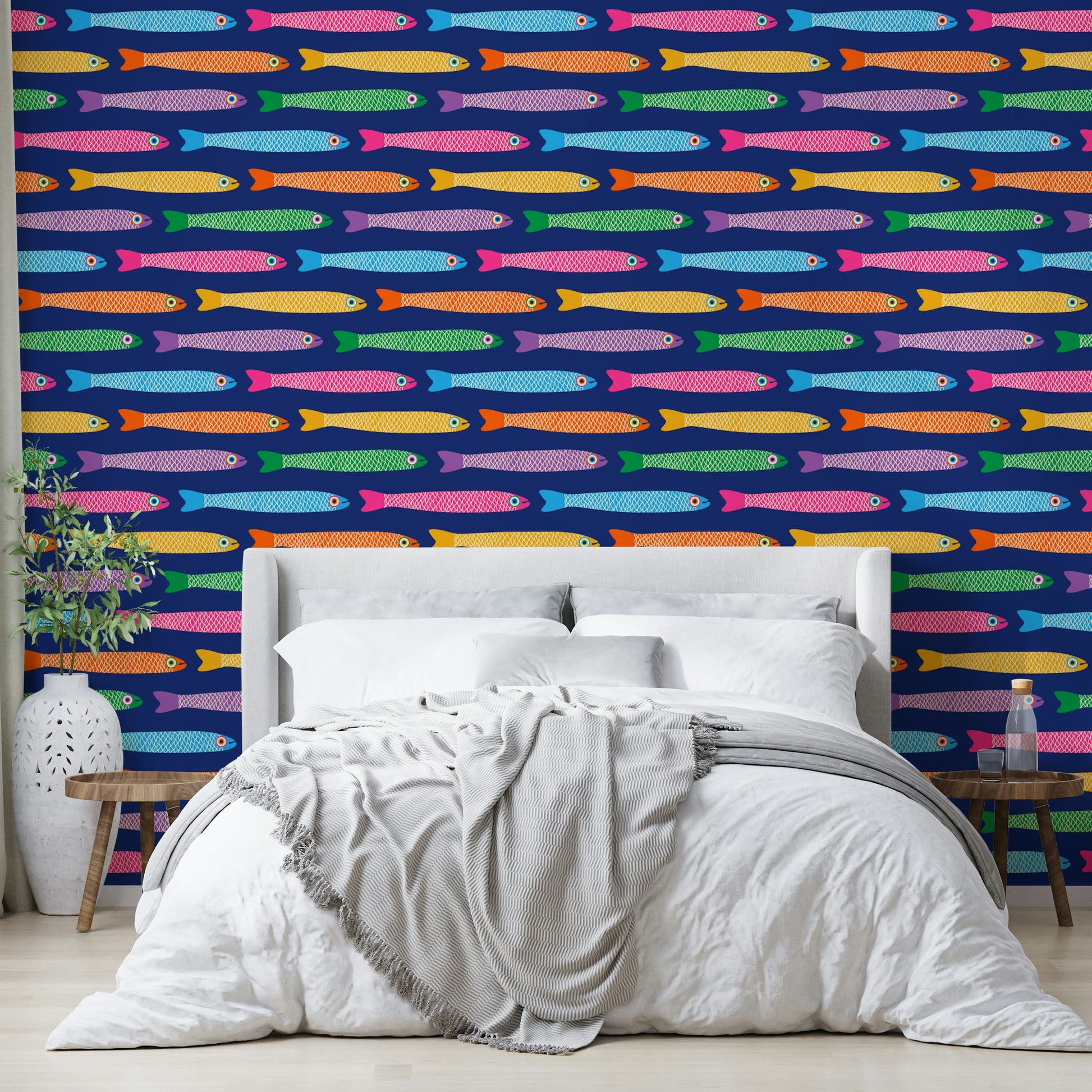 Brightly colored fish design on royal blue wallpaper.

