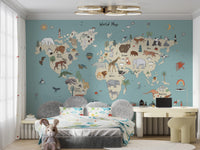 Animal Adventure Atlas wallpaper mural in soft blue above a grey upholstered bed and beige desk in a child's bedroom
