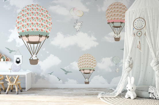 Animals on Balloons in the Sky wallpaper mural with pastel balloons and bunnies in a kids room with a canopy and bunny lamp