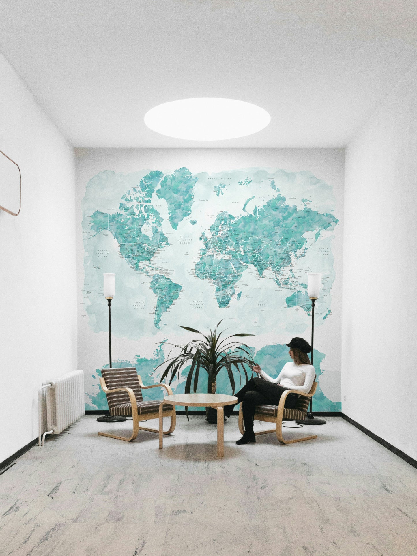 Watercolor world map with ocean-inspired blue palette

