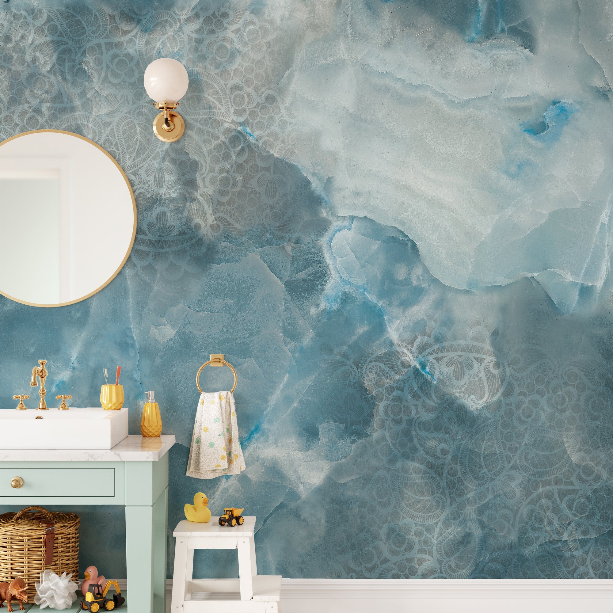 Aqua Stone Cracked Texture wallpaper mural in blue onyx marble on a kids bathroom wall with a green vanity and toys