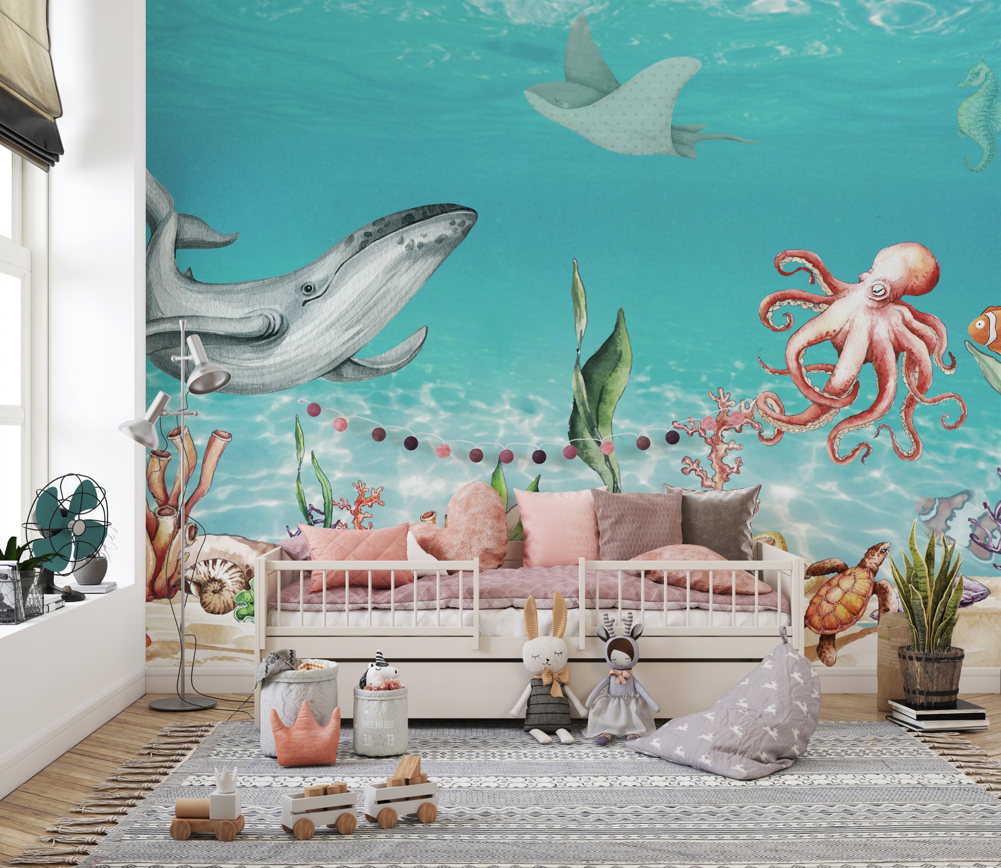 Aquatic Harmony wallpaper mural with whale and octopus in blue water above a pink daybed in a children's bedroom