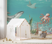 Aquatic Harmony wallpaper mural of a whale, octopus and stingray in teal sea behind a white play tent in a kids room
