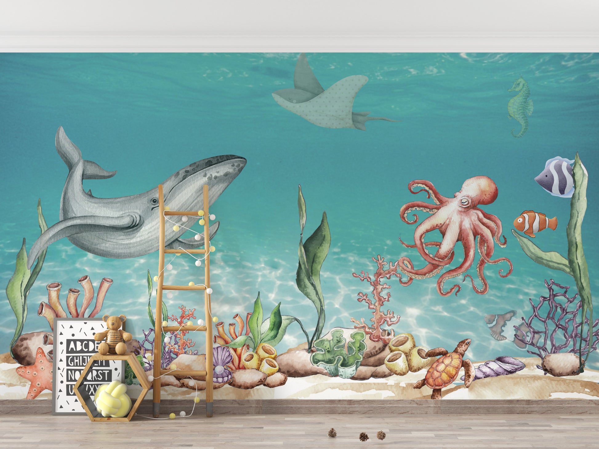 Aquatic Harmony wallpaper mural with a gray whale, red octopus and turtle in turquoise water in a kids room with a ladder shelf