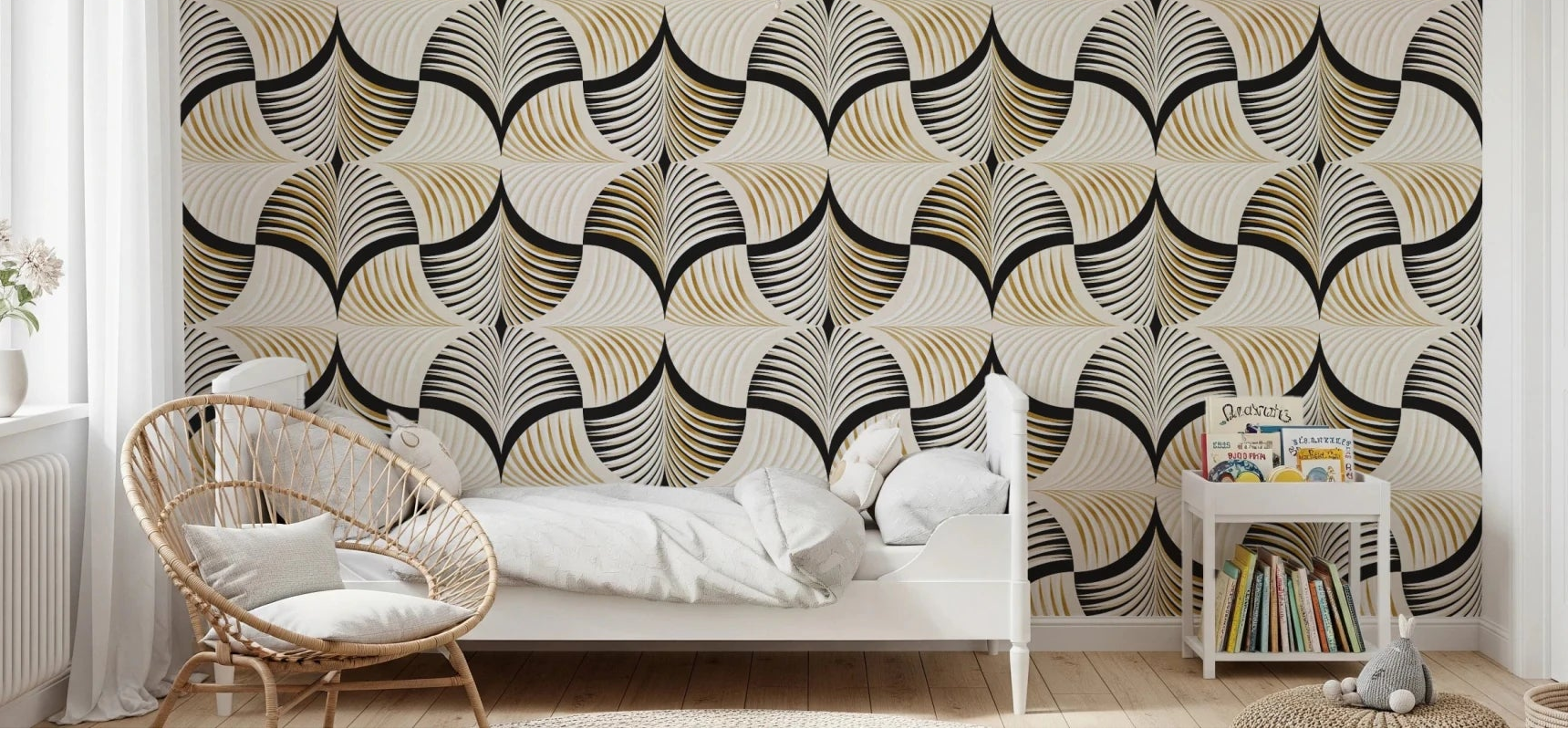 Art Deco Botanical Palm Fan Gold and Black wallpaper behind a white bed and round rattan chair in a child's bedroom