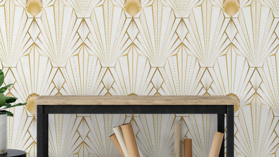 Art Deco Gold Radiance wallpaper in cream and gold fans above a wood console holding rolled wallpaper rolls