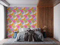 Art Nouveau Botanica Fan Flow Bloom Burst wallpaper with bold florals behind a grey bed by a wood-slat wall