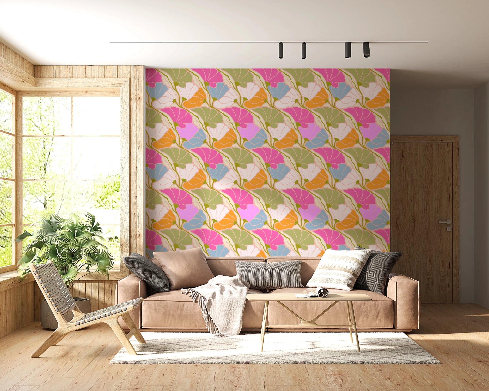 Art Nouveau Botanica Fan Flow Bloom Burst wallpaper behind a tan leather sofa and woven chair in a living room