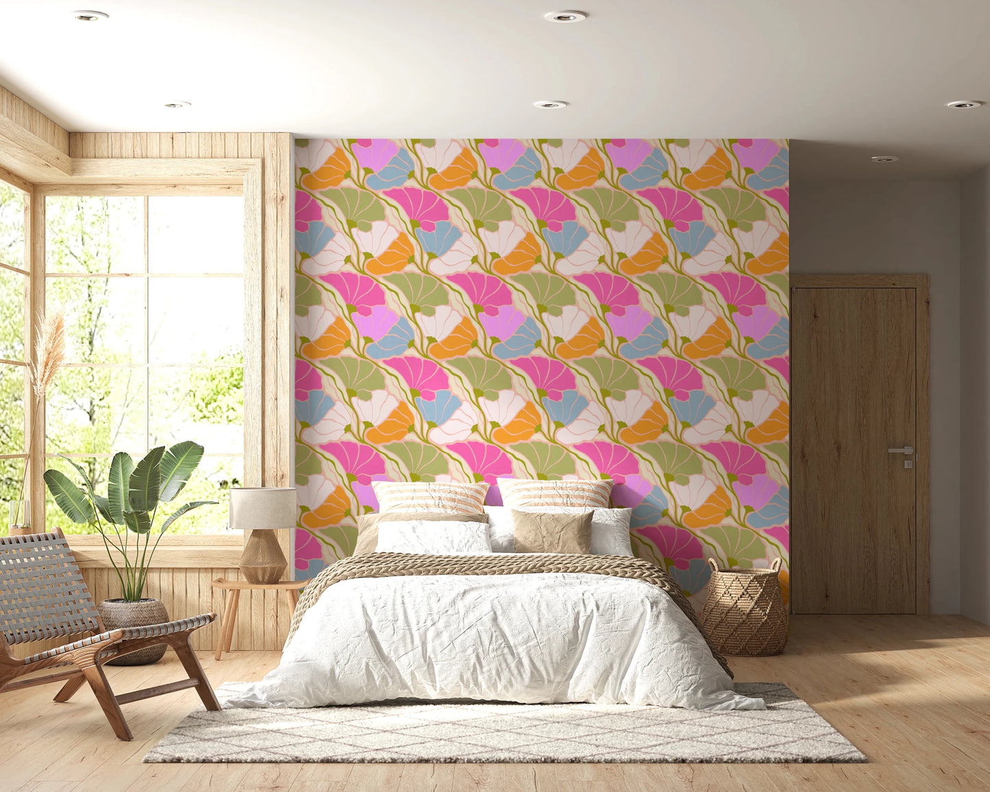 Art Nouveau Botanica Fan Flow Bloom Burst wallpaper behind a white bed with woven headboard in a bedroom
