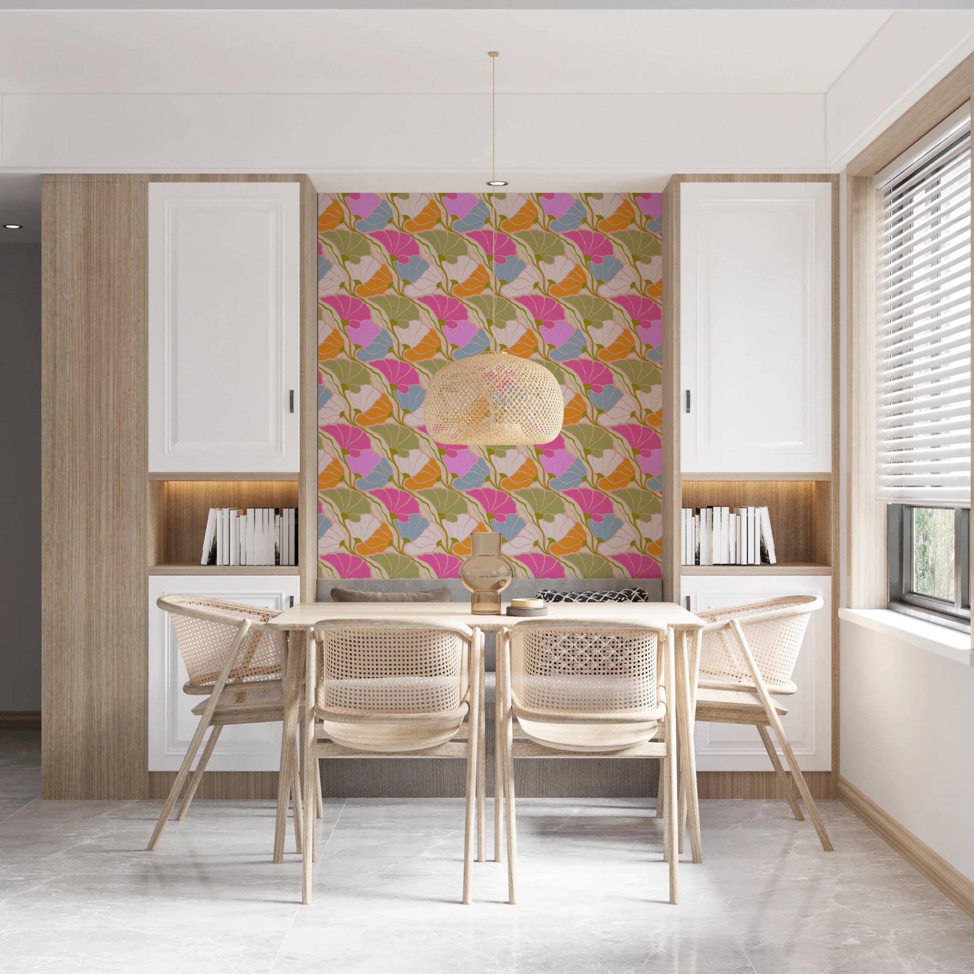 Art Nouveau Botanica Fan Flow Bloom Burst wallpaper behind a wood dining table and rattan chairs in a kitchen nook