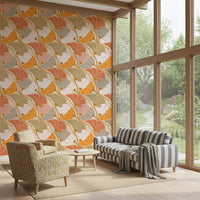 Art Nouveau Botanica Fan Flow Cosy Blooms wallpaper behind a striped sofa by floor-to-ceiling garden windows
