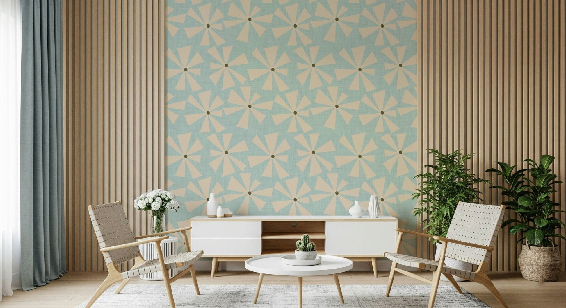 Mid-century inspired wallpaper with geometric pinwheel blooms in cream over a pastel blue backdrop.