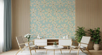 Mid-century inspired wallpaper with geometric pinwheel blooms in cream over a pastel blue backdrop.