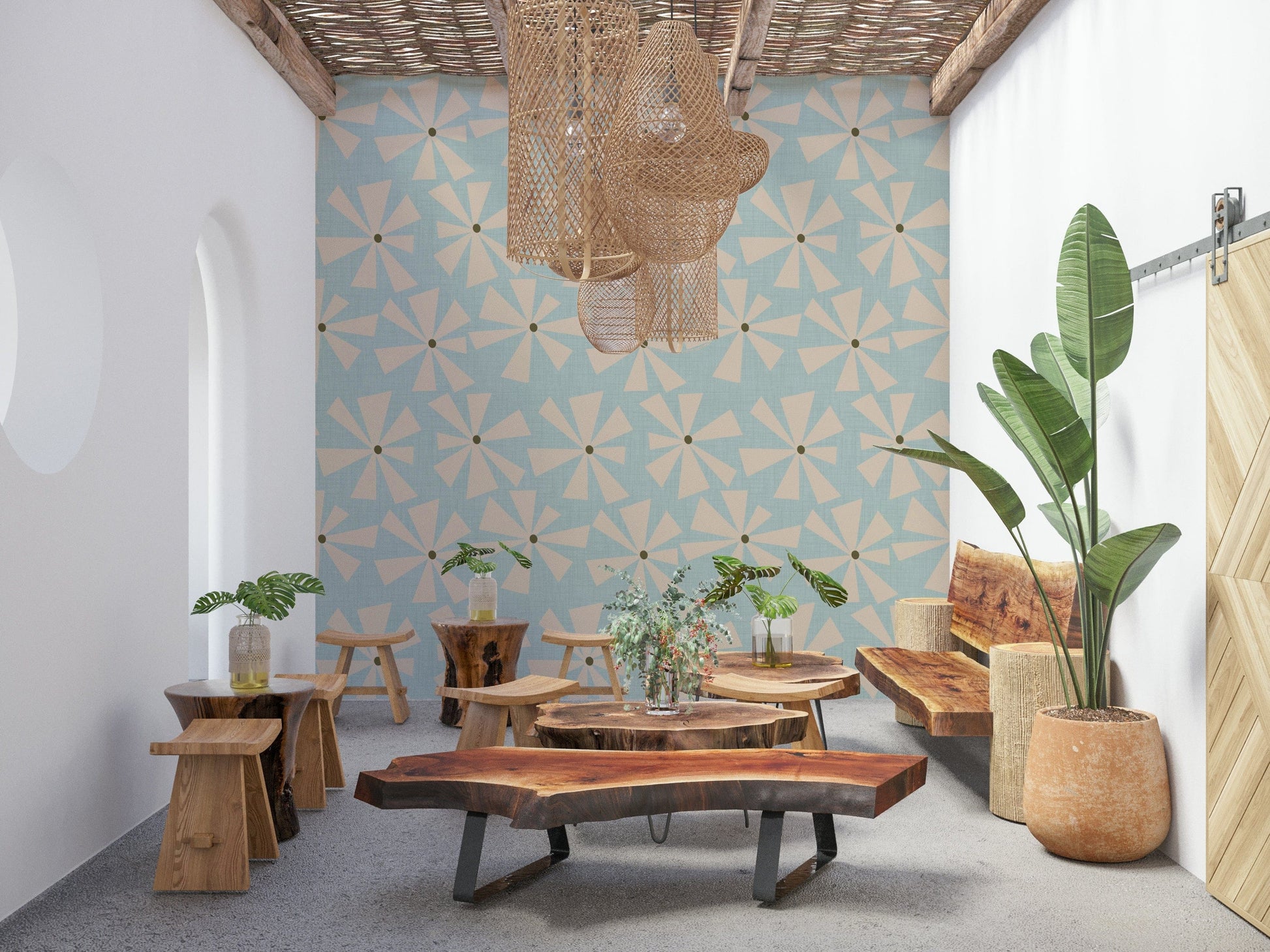 Pastel blue wallpaper with scattered cream starburst blooms in a mid-century modern style.