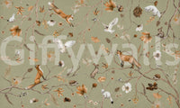 Autumn Arbor wallpaper mural shown as a full-wall design of orange foxes, white owls and rabbits among branches on sage green