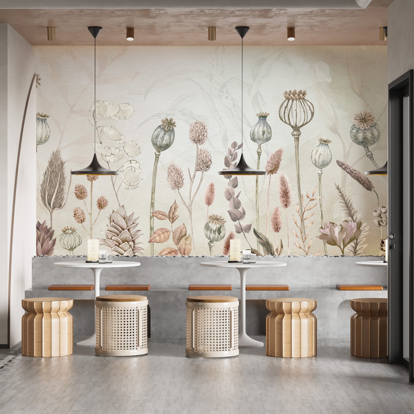 Autumn Flowers wallpaper mural of dried poppy pods behind concrete bench seating and rattan stools in a cafe