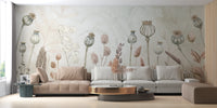 Autumn Flowers wallpaper mural of muted dried botanicals behind beige and grey sofas in a living room