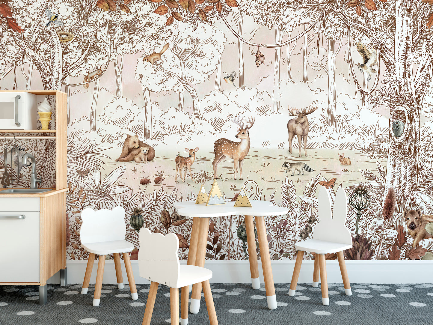 Autumn Forest Friends wallpaper mural of woodland animals behind a play kitchen and bear-ear chairs in a kids room