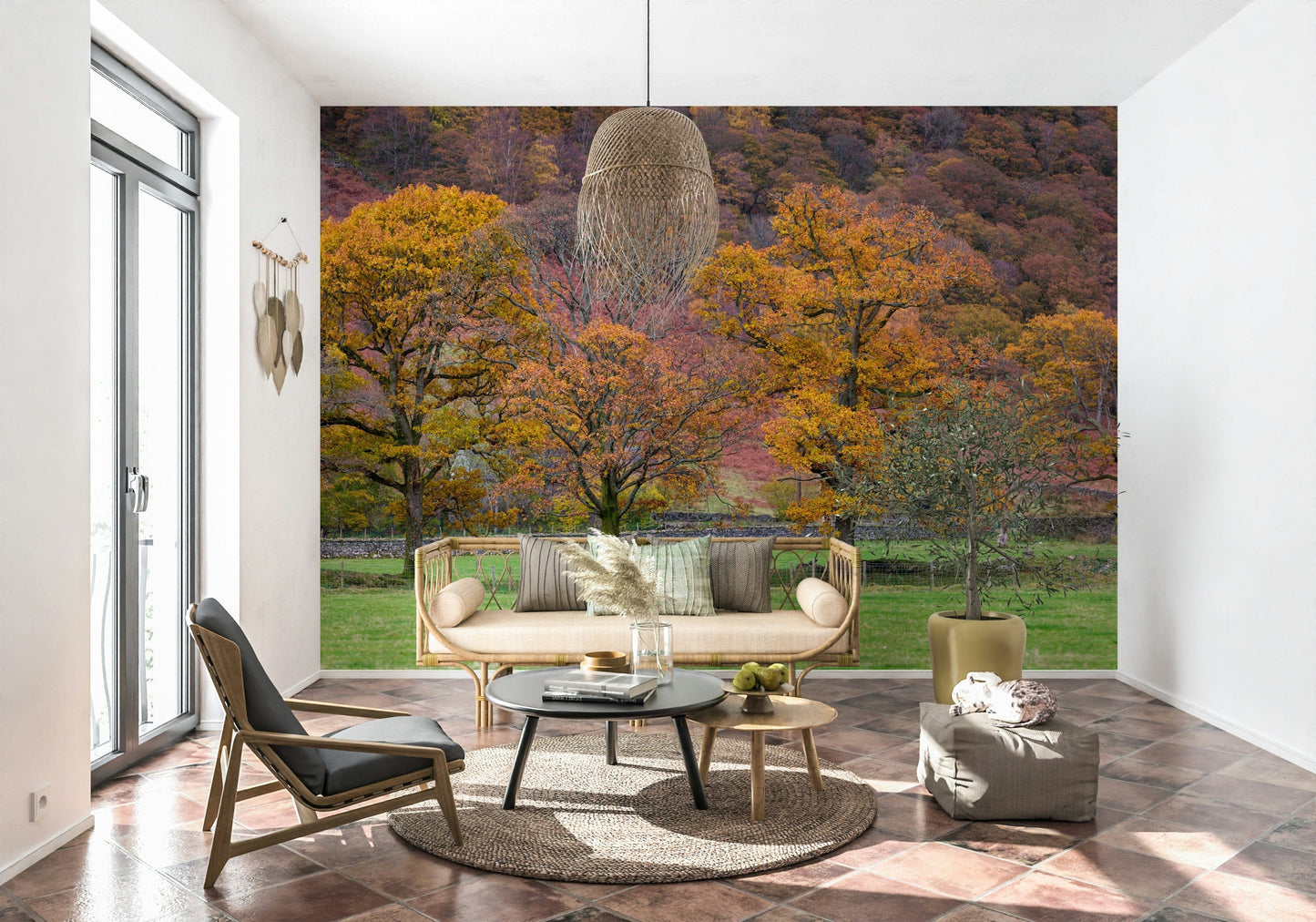 Golden-leafed oak trees set against a colorful hillside create a soothing autumn wallpaper.